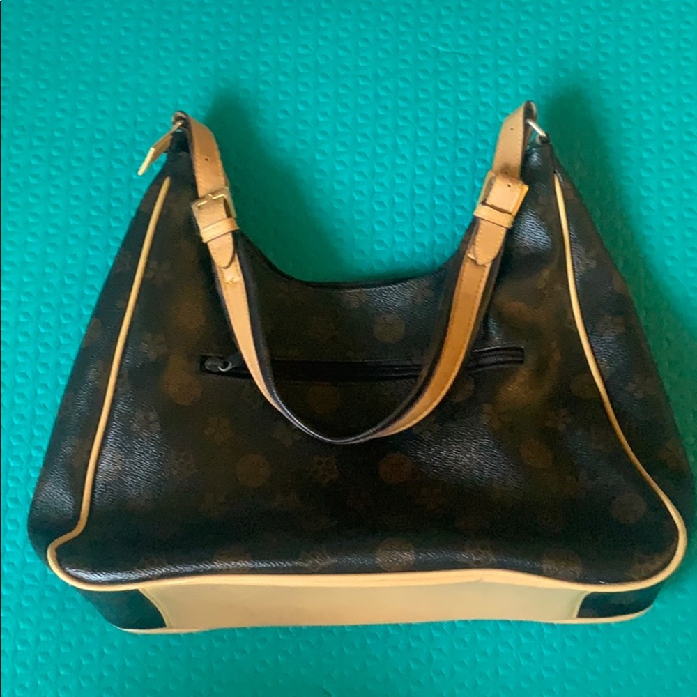 Luxury women’s handbag with gold and brown accents